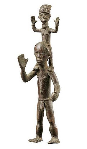 Figure 009001; Ldamie brass caster brass casting Dan 
				Gio people / Liberia; male acrobats; collected in 1962 by Paolo Morigi; brass; 11 in. (28.5 cm); Collection of William Logan Fry; No. 009001